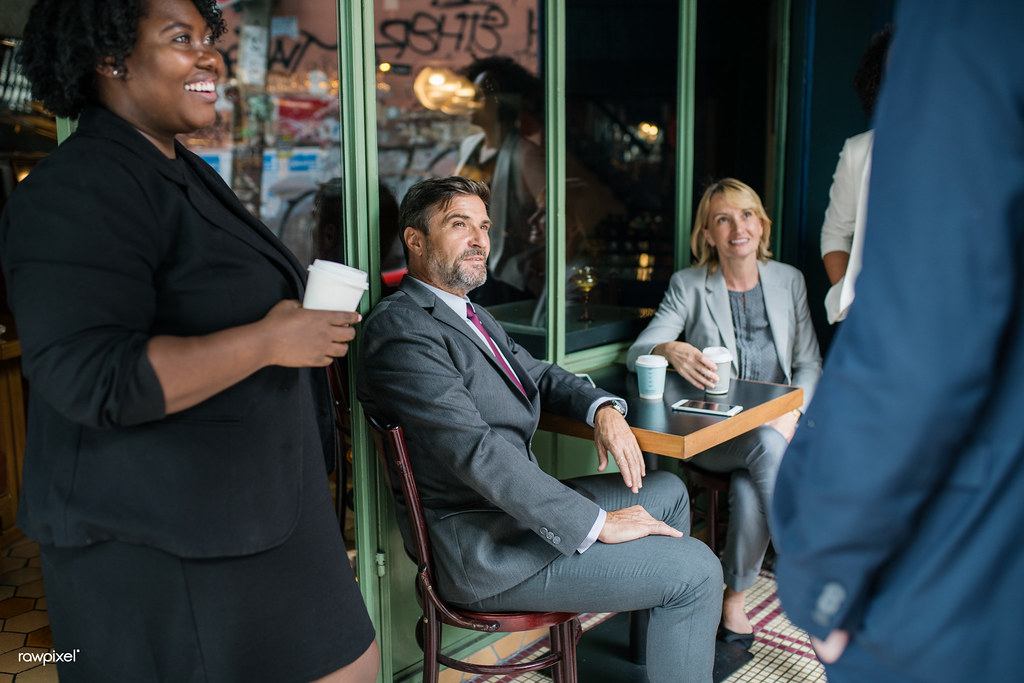 Professionals in a team meeting discussing outsourced benefits administration